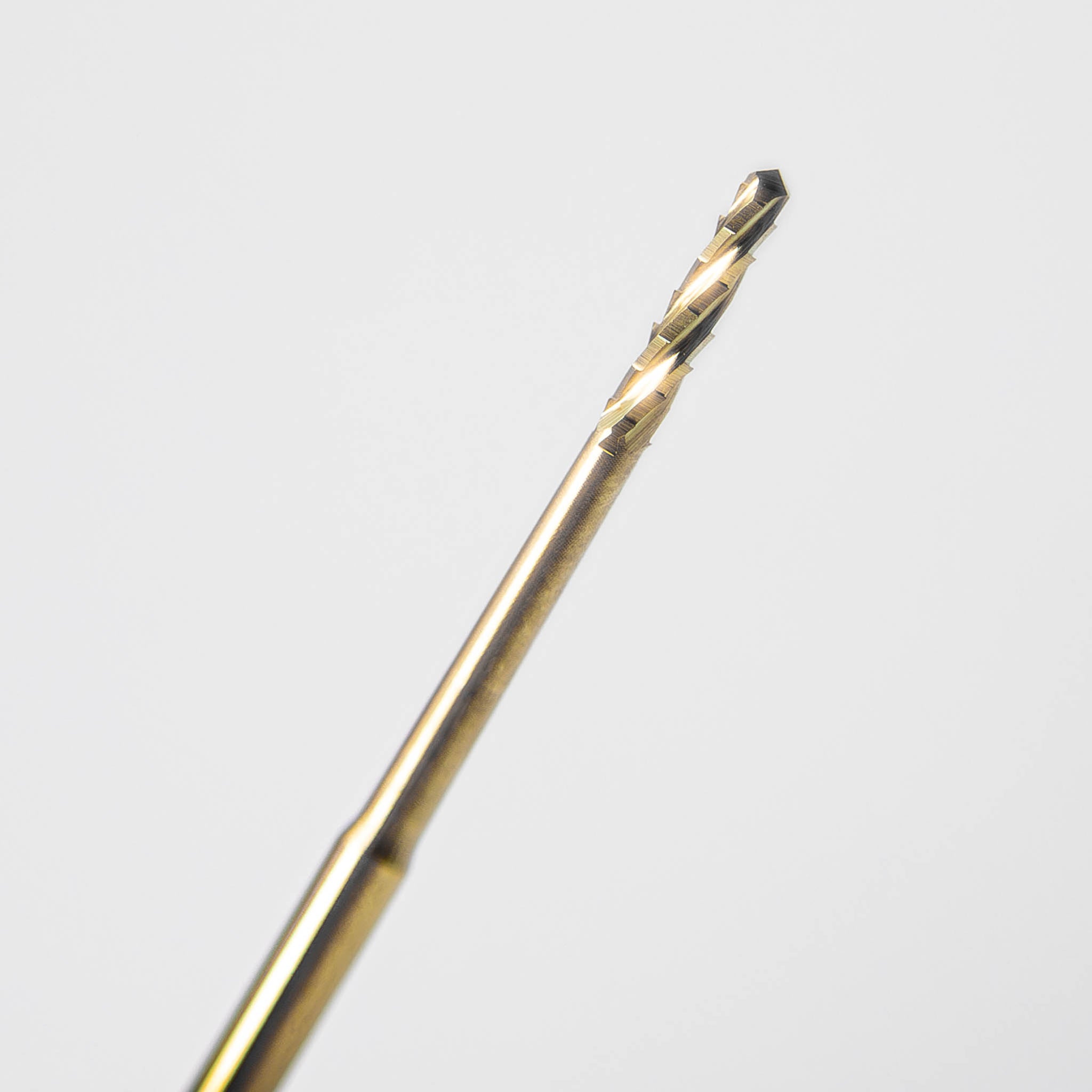 A close-up of a bone saw with a golden finish, providing enhanced wear resistance and smooth cutting performance, ideal for bone surgery.