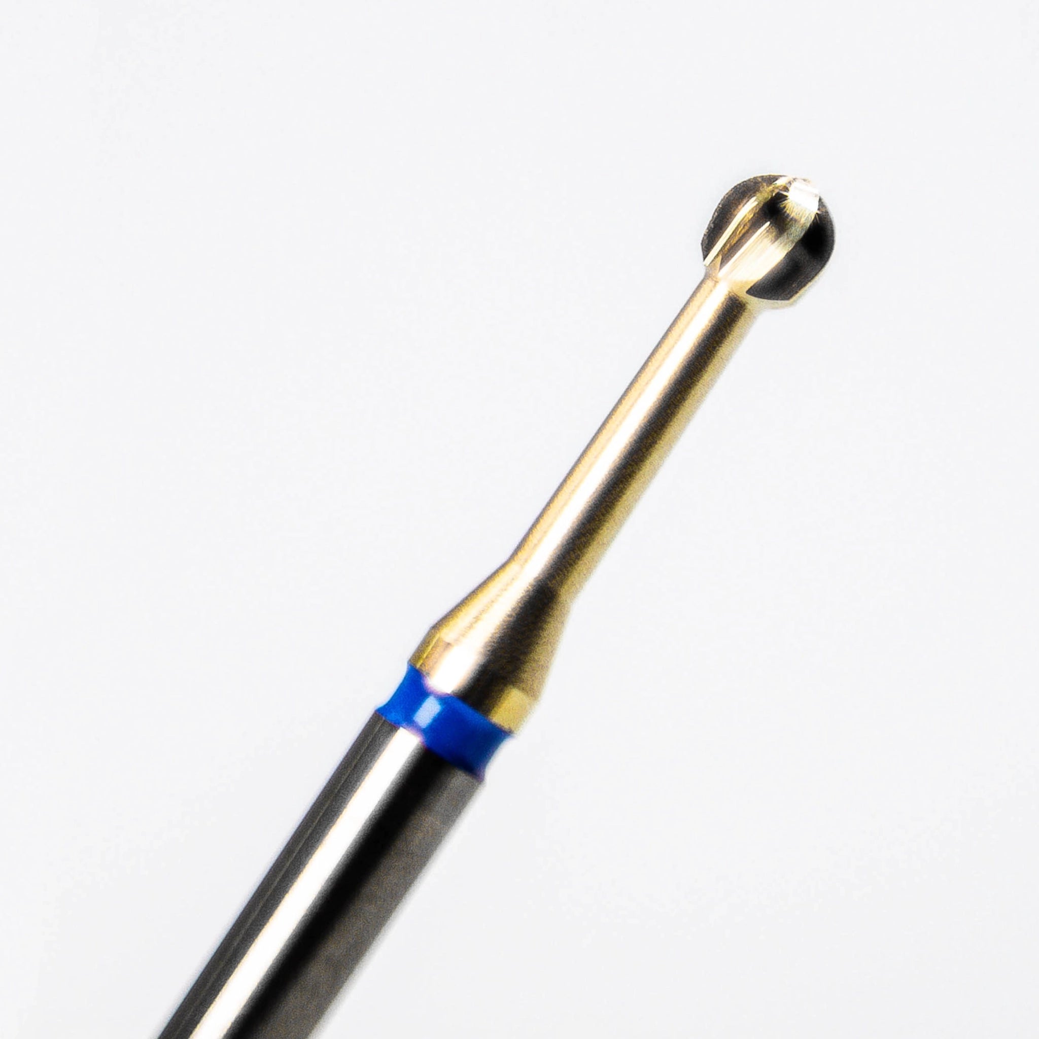 A close-up of an advanced tungsten carbide endodontic bur for slow-speed dental procedures, designed to clean the pulp chamber and access canal openings; features a titanium nitride coating for durability and precision, with low heat and vibration for enhanced patient comfort.