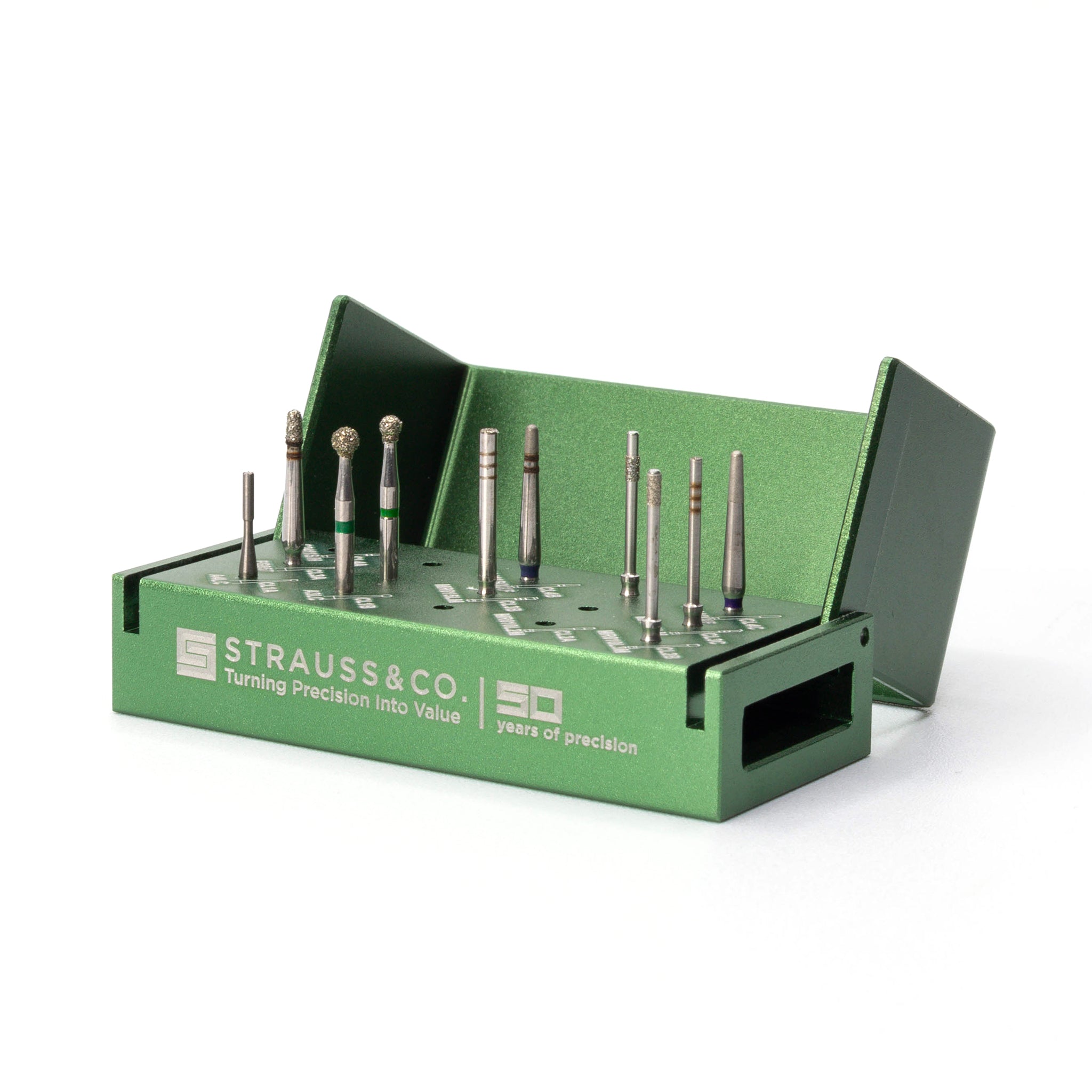 A green Strauss-branded Crown Lengthening Bur Kit containing multiple diamond and carbide burs arranged neatly in slots with engraved labels for each bur type. The kit is designed for precise and predictable crown lengthening procedures.